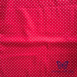 Red fabric with tiny white heart for fall capsule wardrobe